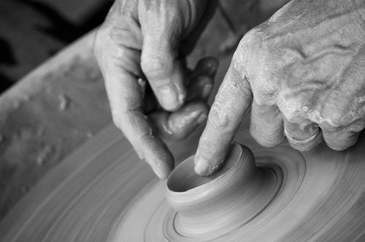 hands, clay, pottery, pottery wheel, throwing, wrinkles, wrinkled, elderly, person, ceramic, wheel, skill, sculpting, bowl, movement, black and white, craft, creativity, mud, gray