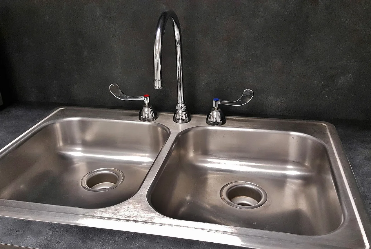 basin, sink, nature, kitchen sink, tap, drain, faucet, countertop, water, plumbing, dishes, dirty dishes, dishwashing, wash, clean, shiny, stainless steel, gray water, gray kitchen, gray clean. What survives in a wet pottery studio: stainless steel, sealed surfaces and refractory brick