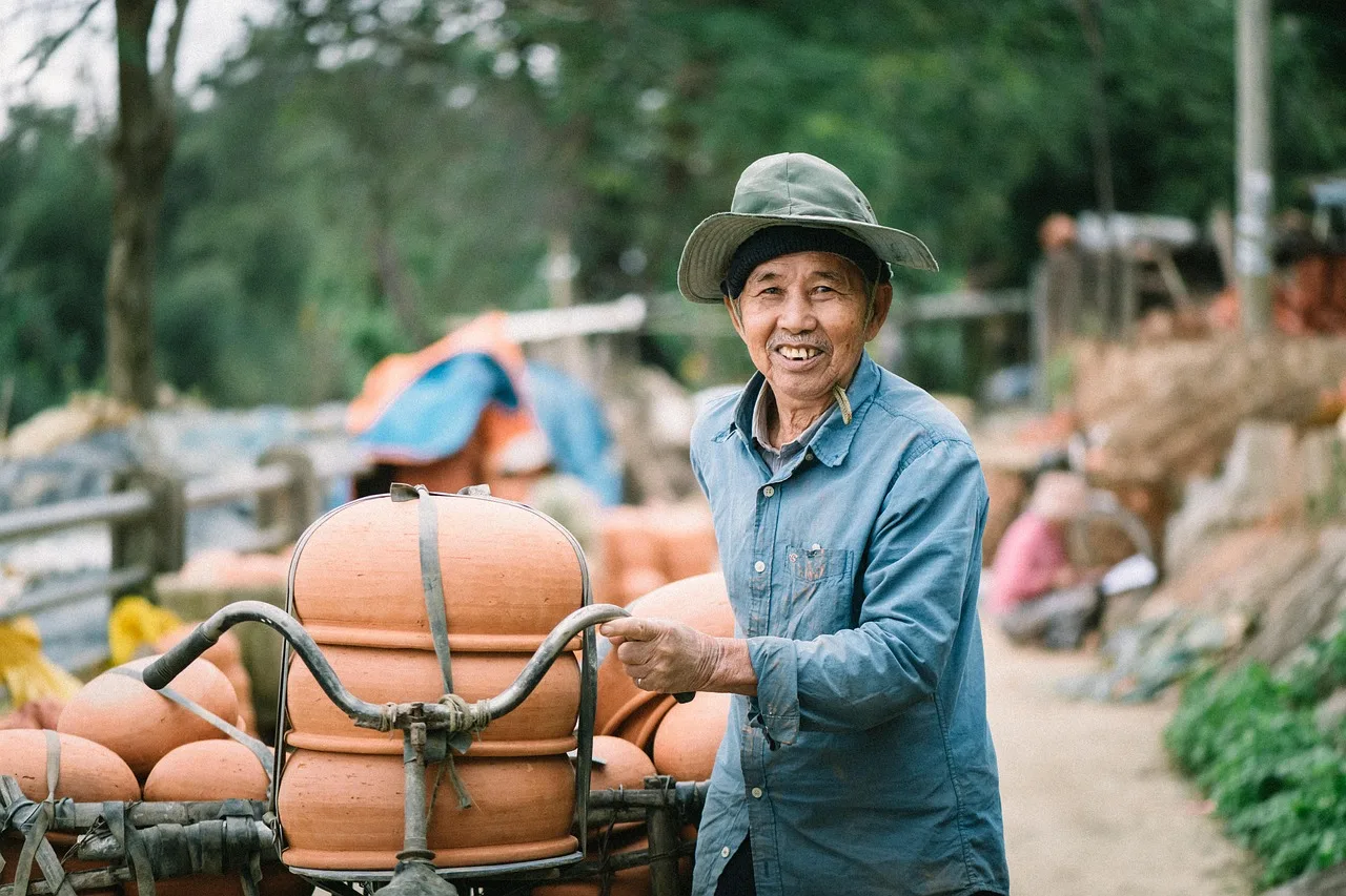 pottery, man, delivery, hoi an, craftsman, craftsmanship, clay pots, earthenware, asian man, vietnamese man, portrait, smile, smiling, pottery, delivery, delivery, delivery, delivery, delivery, asian man. Home pottery cost per pot compared with cost per bag of clay bought at once