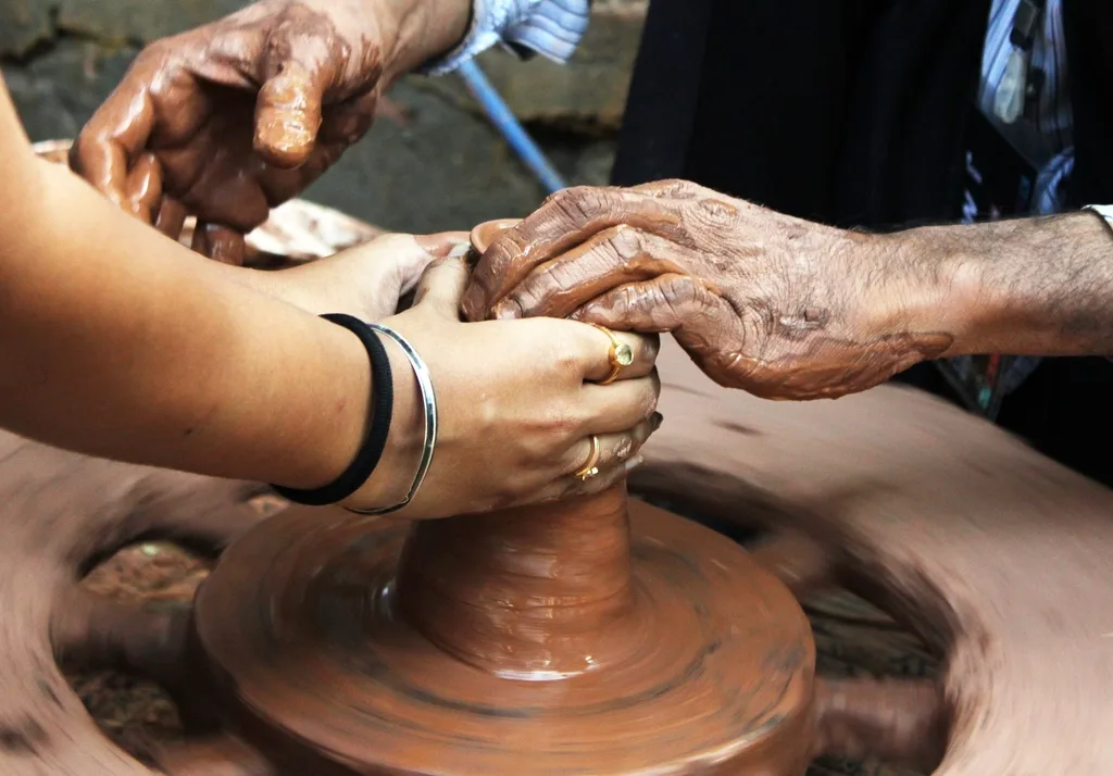 Working clay potetry studio. Why is sourcing clay and drying greenware different in St. John's and Halifax?